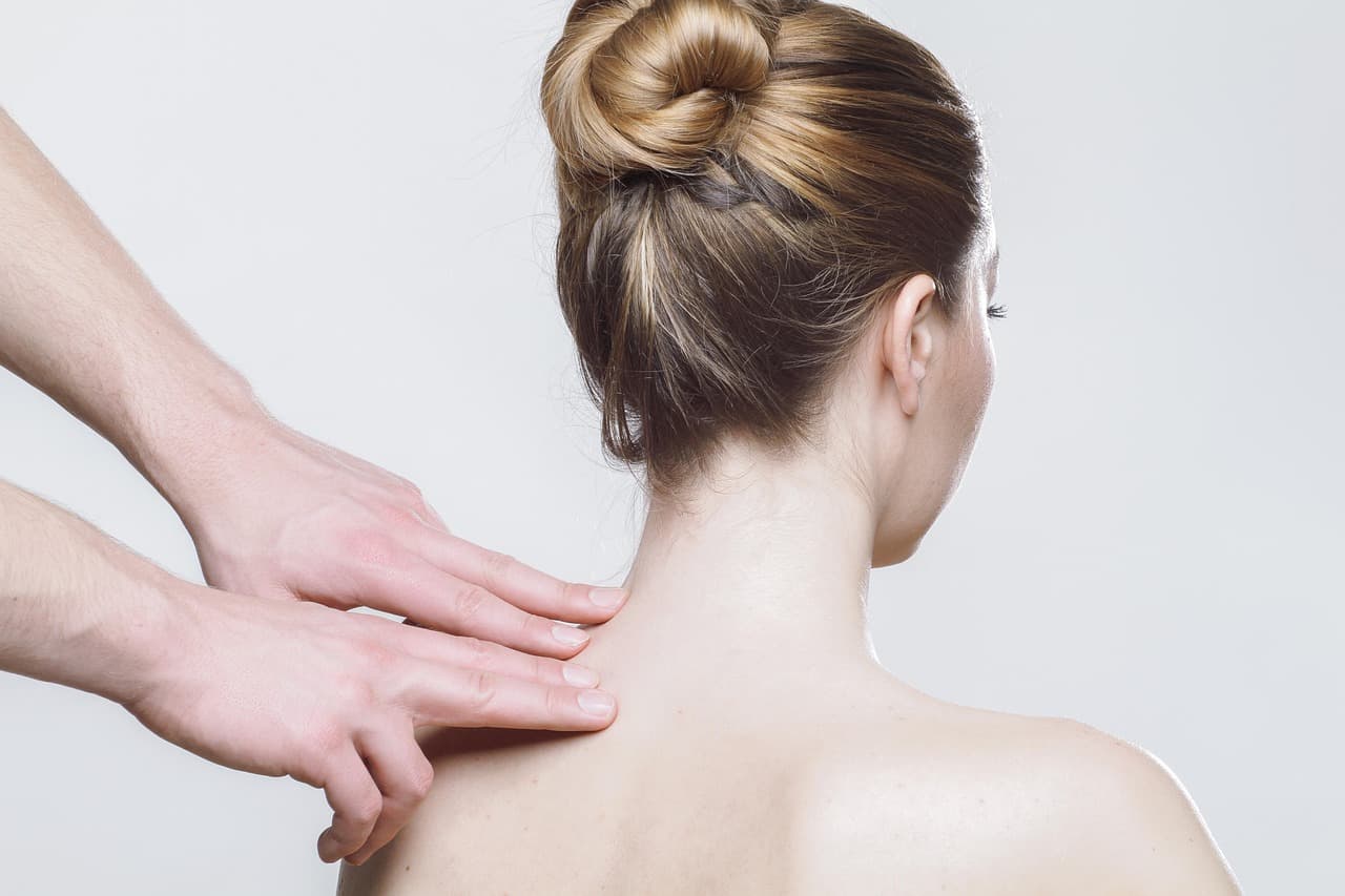 Physiotherapist checking a patient's shoulder